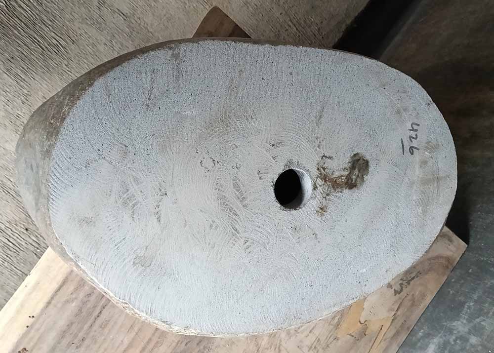 Bottom of polished gray river stone sink with visible drain hole – 6426-5836
