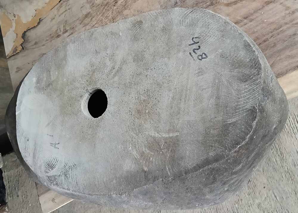 Bottom view of polished river sink with visible drain hole – 6428-5332
