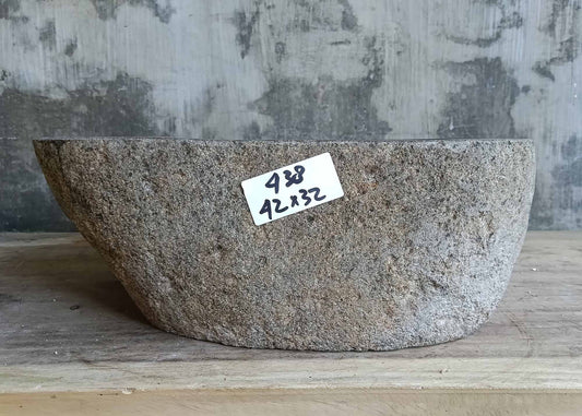 Front view showing the cylindrical profile of the gray river stone sink
