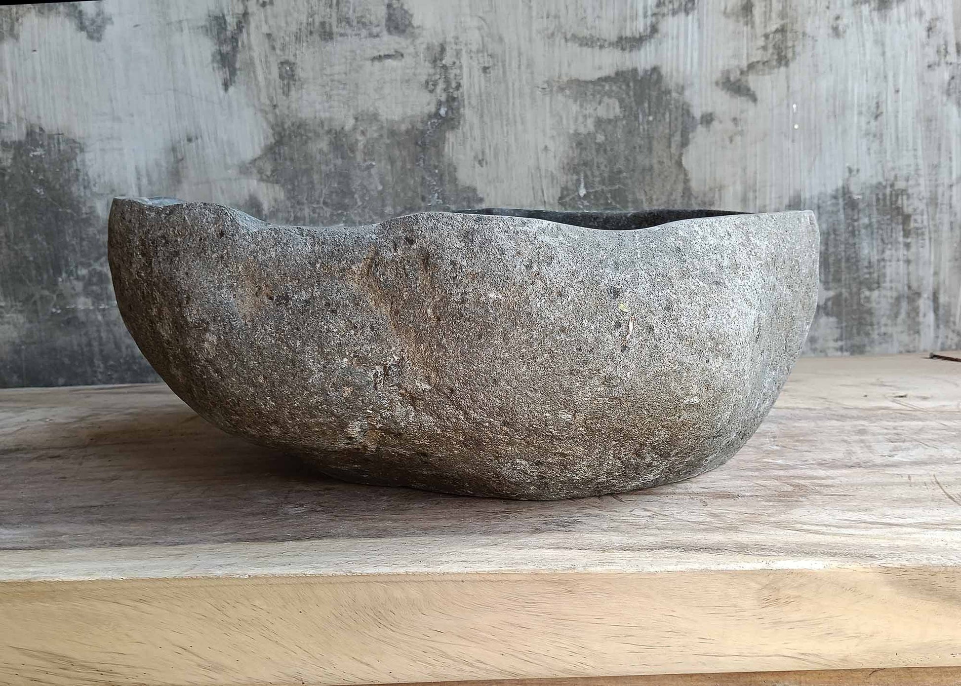 Backside of stone sink 6445-4236 with rough natural texture and oval form
