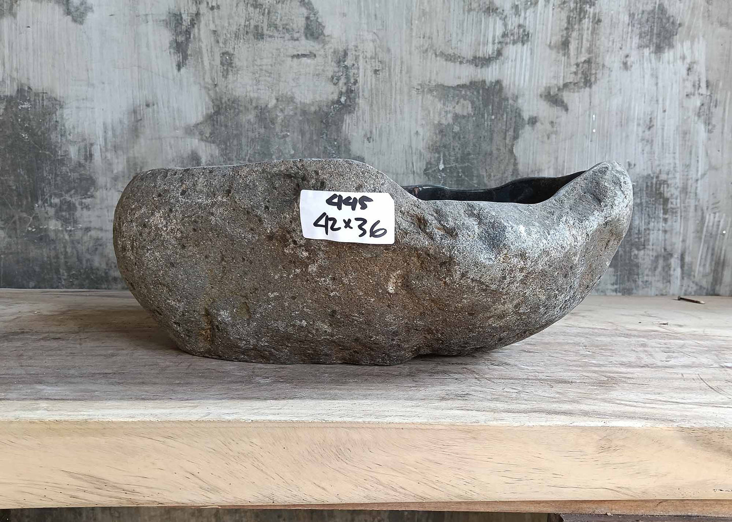 Front view of sink 6445-4236 showing rugged stone exterior and organic shape
