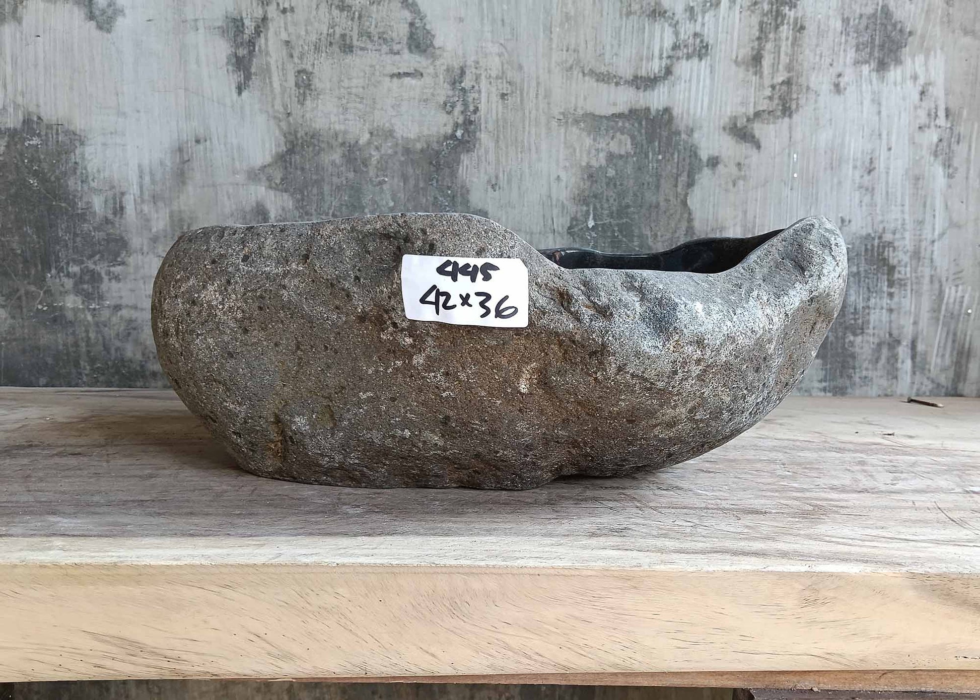 Front view of sink 6445-4236 showing rugged stone exterior and organic shape
