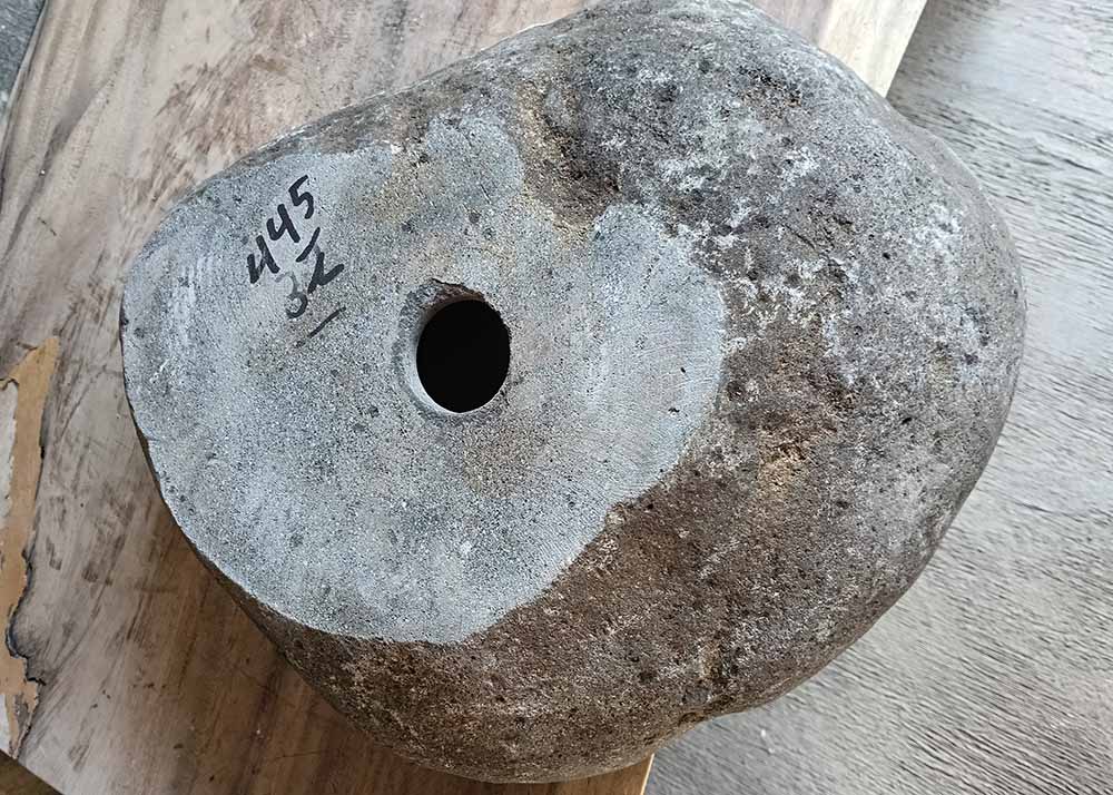 Bottom view of stone sink 6445-4236 showing raw finish and drain outlet
