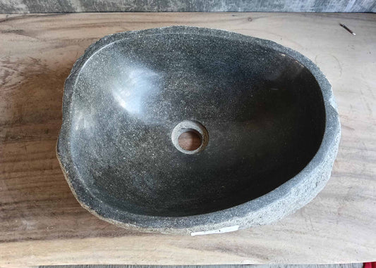 Top view of handcrafted river stone sink 6452-4536 with smooth dark gray basin
