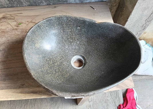 Top view of handcrafted river stone sink 6468-4634 with polished dark gray basin
