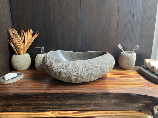Graphite-gray boat-shaped natural river stone vessel sink RSS-002 in a bathroom vanity setting