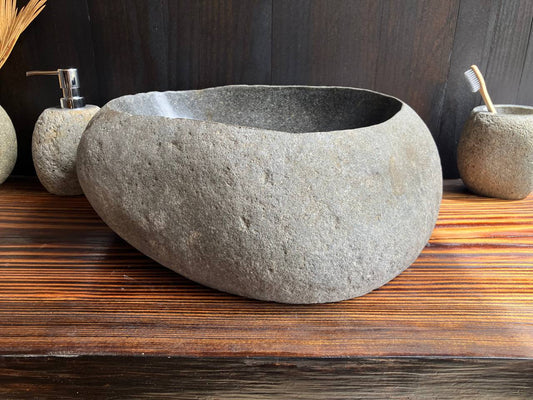 Front angled view of massive gray river stone vessel sink RSS-005