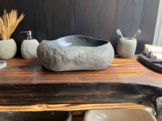 Premium graphite-gray river stone vessel sink RSS-006 in a bathroom vanity setting