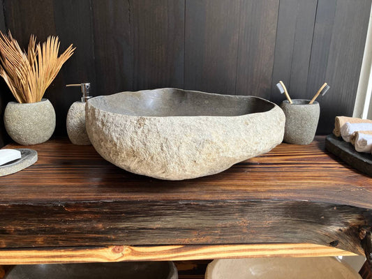 Natural gray river stone vessel sink RSS-007 in a bathroom vanity setting