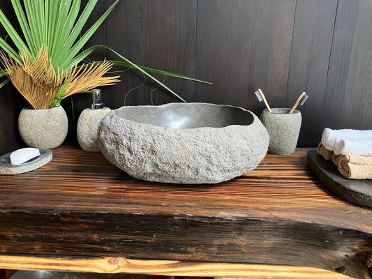 Premium matte-black river stone vessel sink RSS-010 in a bathroom vanity setting