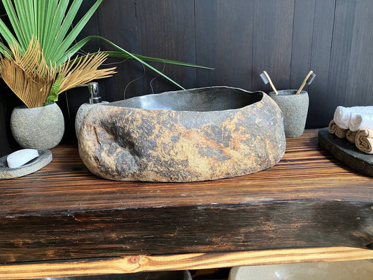 Premium rust-toned river stone vessel sink RSS-011 in a bathroom vanity setting
