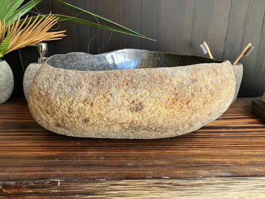 Front angled view of naturally textured river stone sink RSS-013