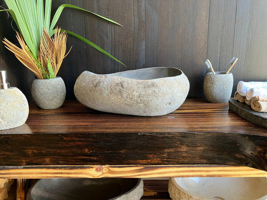Light-gray teardrop river stone vessel sink RSS-015 in a bathroom vanity setting