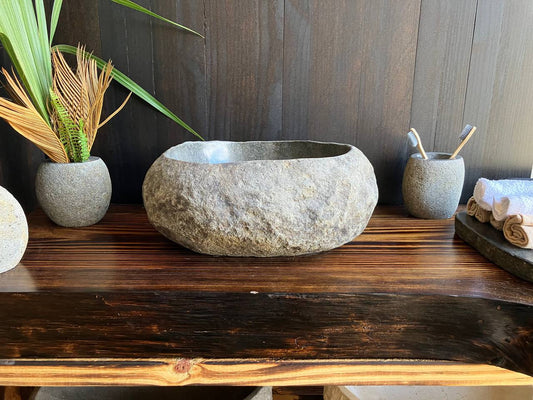Premium compact river stone vessel sink RSS-018 in a bathroom vanity setting