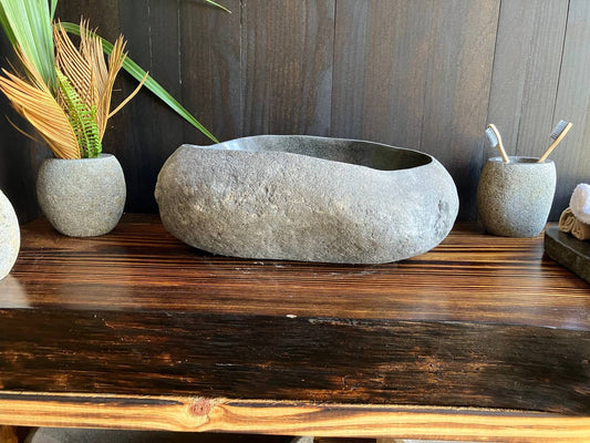 Premium gray-brown river stone vessel sink RSS-019 in a bathroom vanity setting