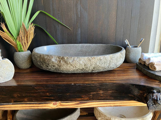 Premium large beige-gray river stone vessel sink RSS-020 in a bathroom setting