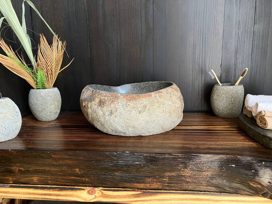 Premium compact river stone vessel sink RSS-022 in a bathroom vanity setting