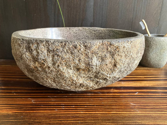 Front view of rounded beige river stone sink RSS-045