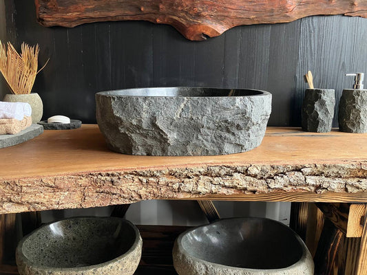 Triangular andesite stone vessel sink ANS-004 with a black interior, viewed from above