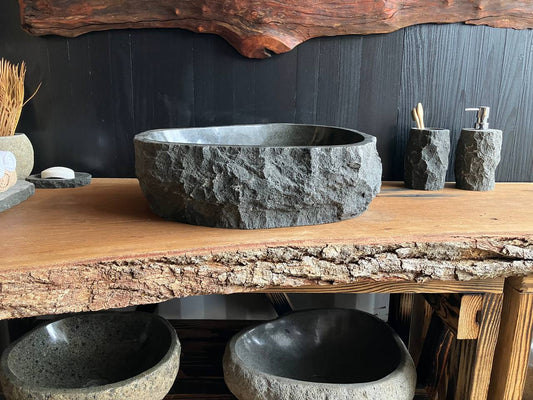 Graphite-gray andesite stone vessel sink ANS-005 with an organic triangular avocado-like shape, viewed from above