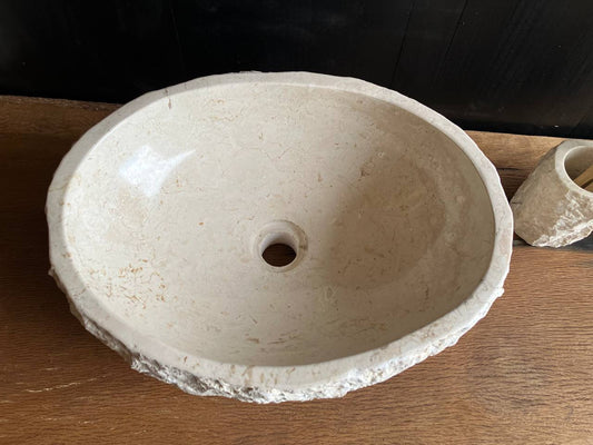 Natural beige marble bathroom vessel sink BMS-001 showing its rough chiseled cream-colored exterior
