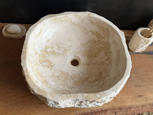 Natural beige marble bathroom vessel sink BMS-002 showing its rough chiseled exterior