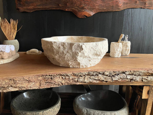 Beige marble vessel sink BMS-003 with an organic freeform shape, irregular contours, and a polished basin