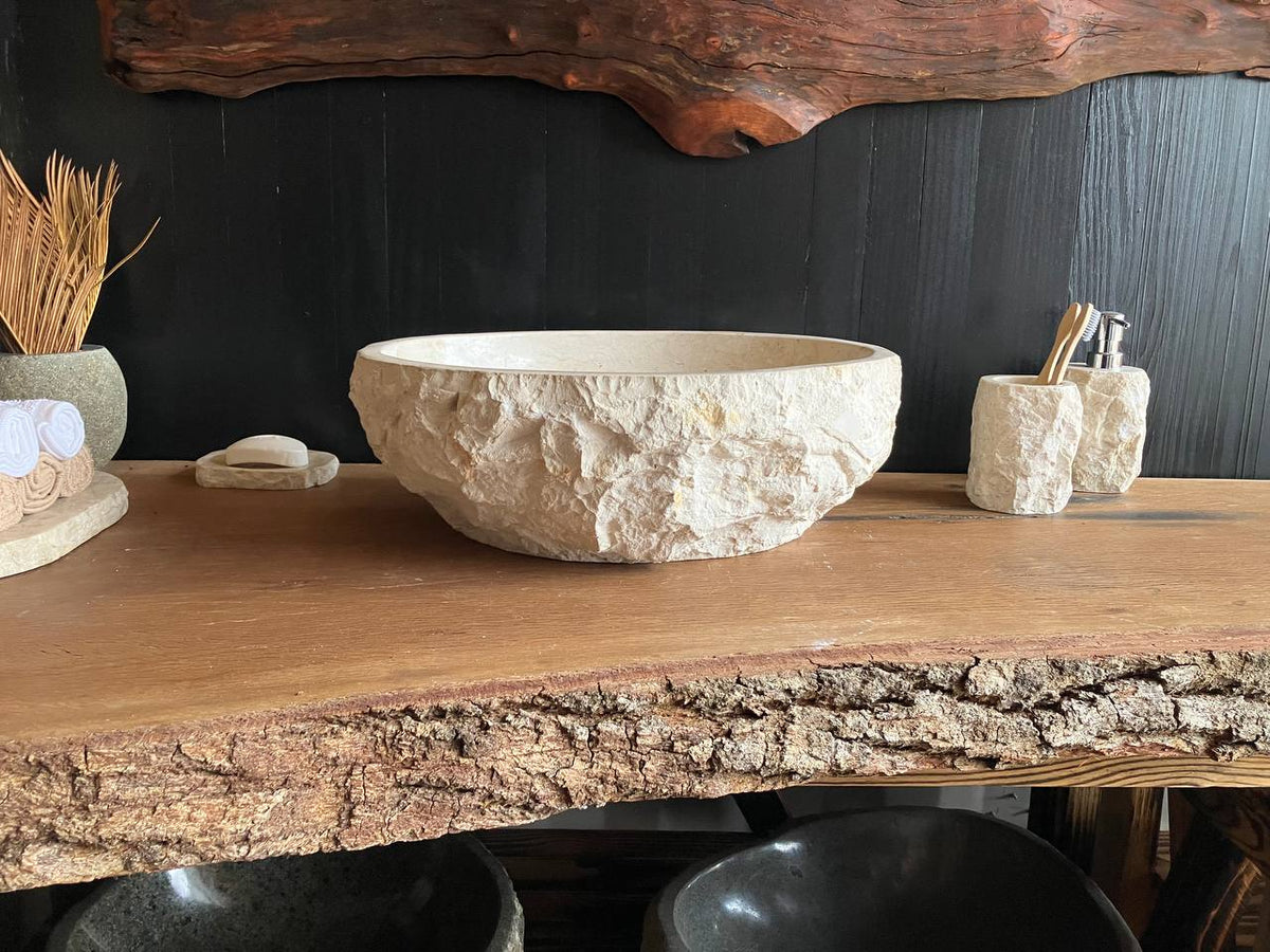Compact beige marble vessel sink BMS-004 with an oval shape and polished basin, viewed from above