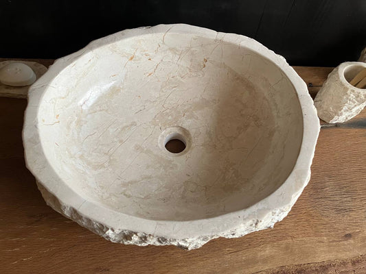 Natural beige marble bathroom vessel sink BMS-006 showing its rough chiseled stone exterior