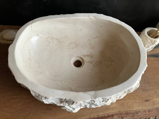 Natural beige marble bathroom vessel sink BMS-007 showing its rough chiseled stone exterior
