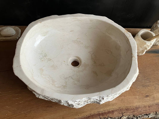 Natural beige marble bathroom vessel sink BMS-011 showing its rough chiseled exterior