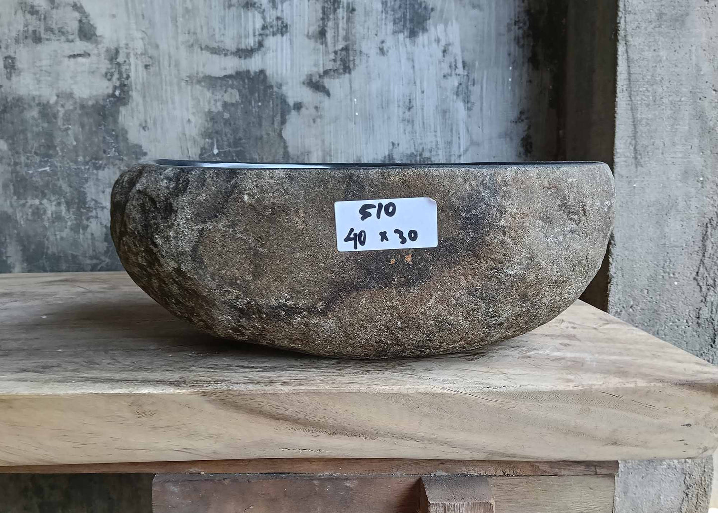 Front view of handcrafted stone sink 6510-4030 with natural rough exterior
