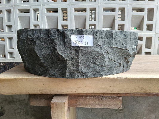 Front view of A42-5041 andesite stone vessel — polished interior bowl
