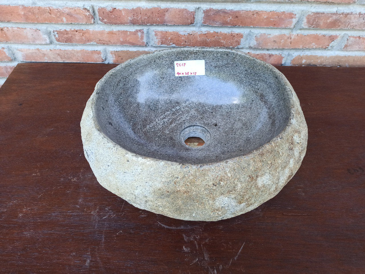 Top view of 5017-403817 natural river stone sink — polished interior and rough exterior
