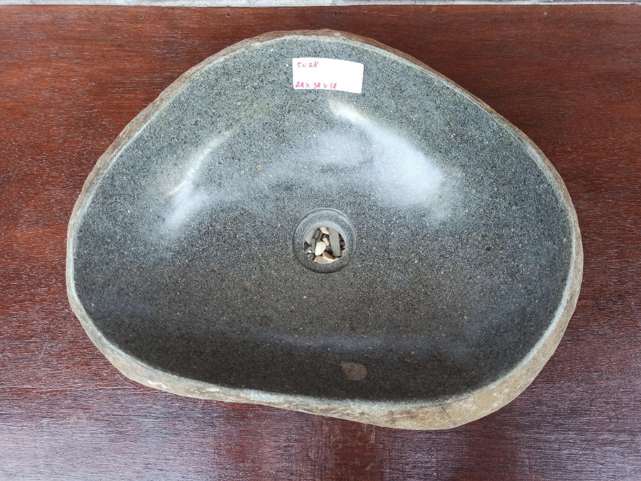 Top view of 5028-443414 natural river stone sink — polished interior and rough exterior surface
