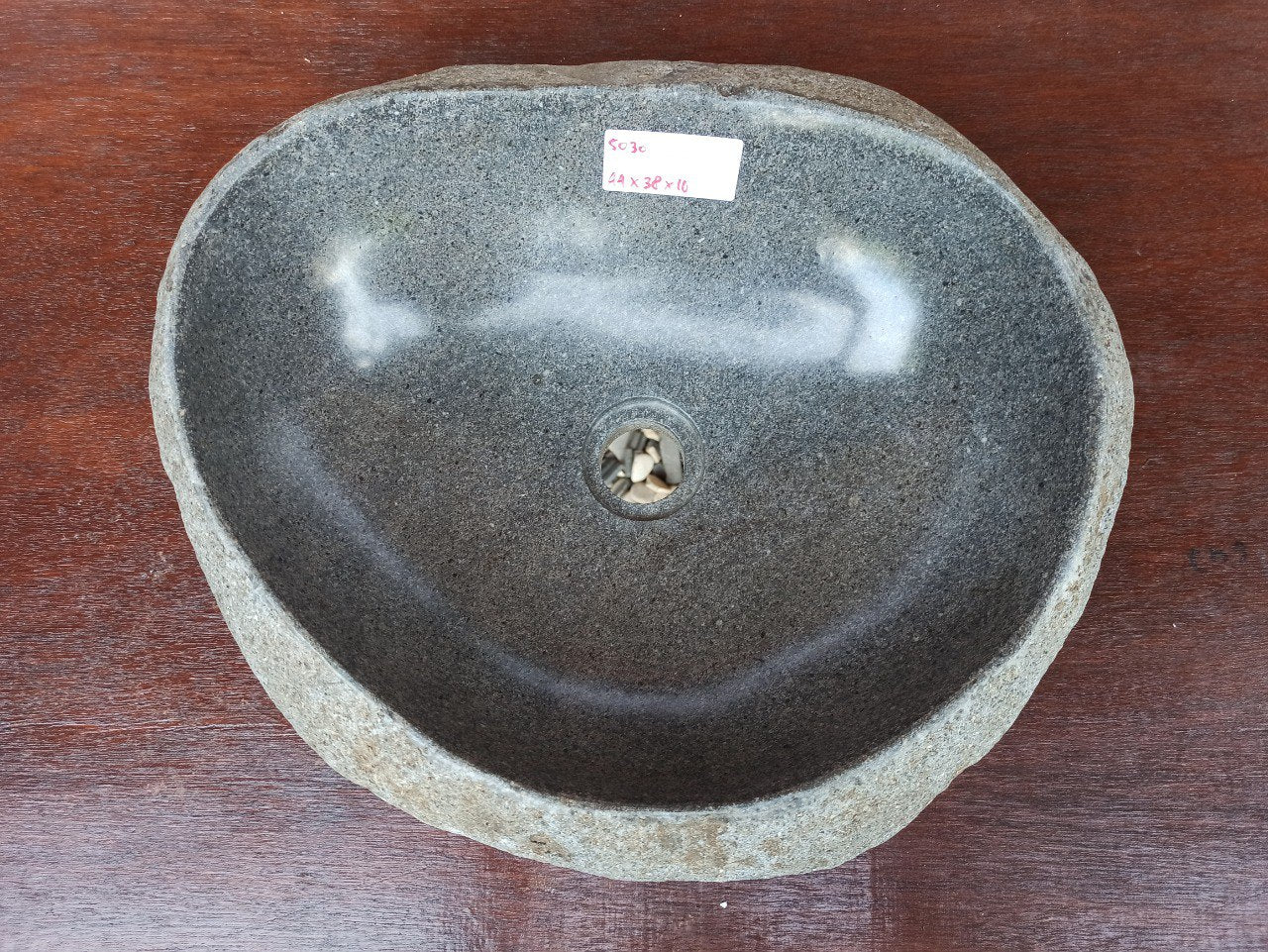 Top view of 5030-443816 natural river stone sink — polished interior and rough stone exterior
