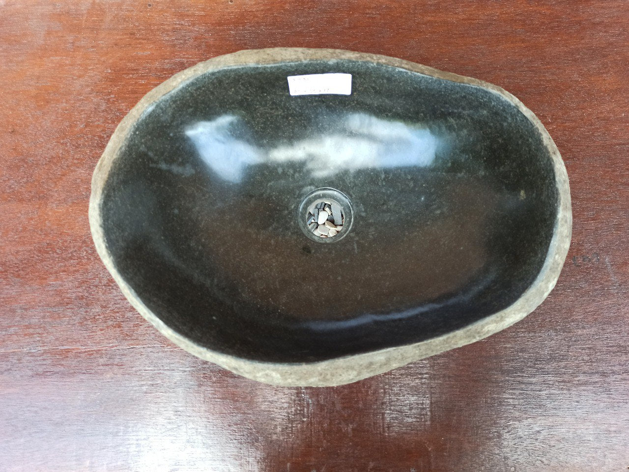 Top view of 5031-453517 natural river stone sink — polished interior and textured exterior
