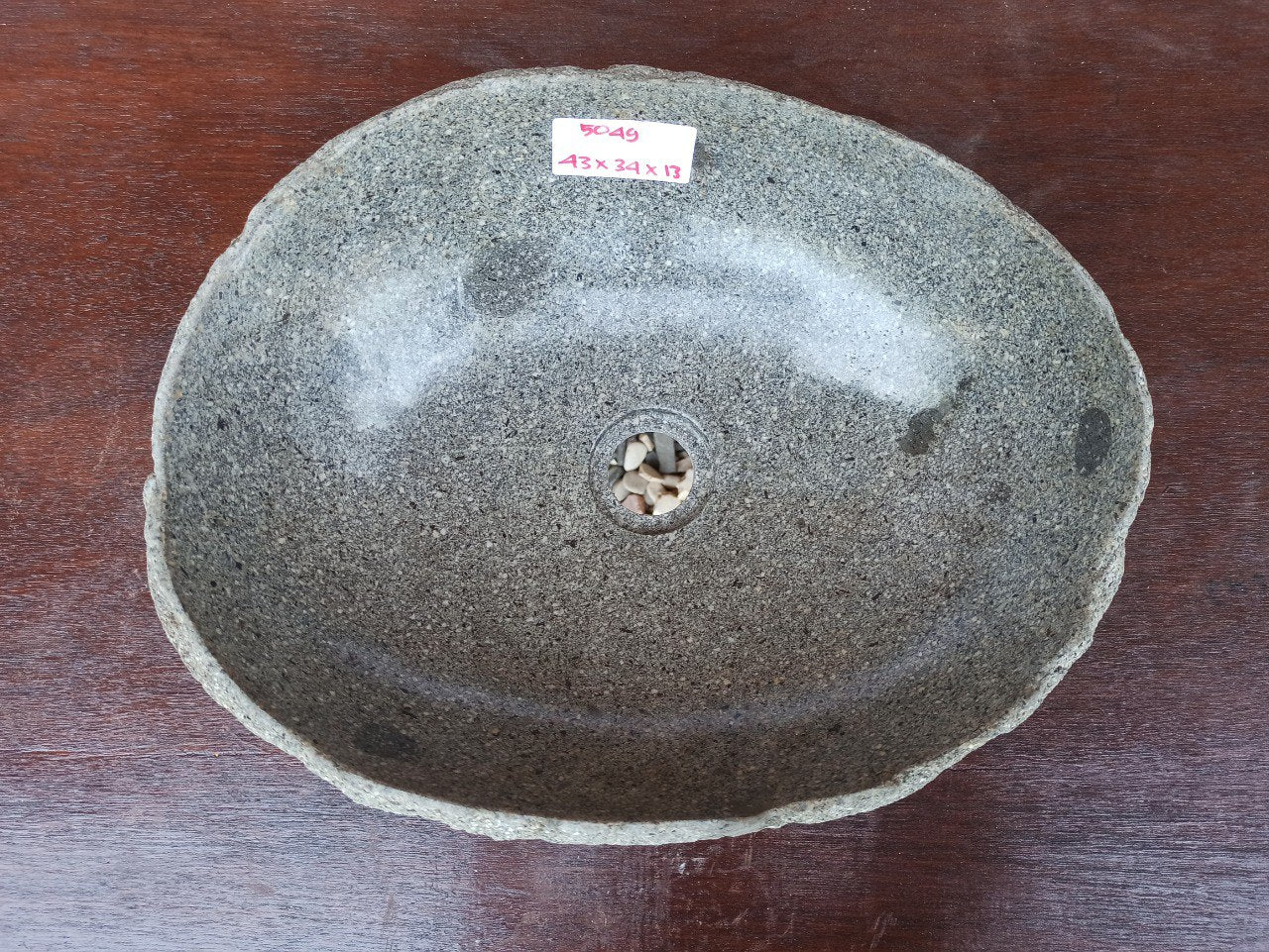 Top view of 5049-433413 natural river stone sink — polished interior and rough exterior texture
