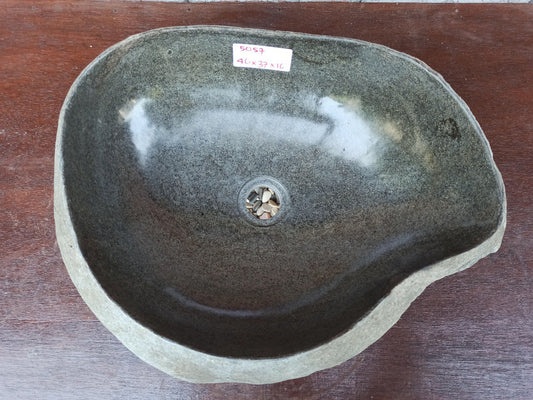 Top view of 5057-463717 river stone sink — asymmetric handcrafted basin with polished interior
