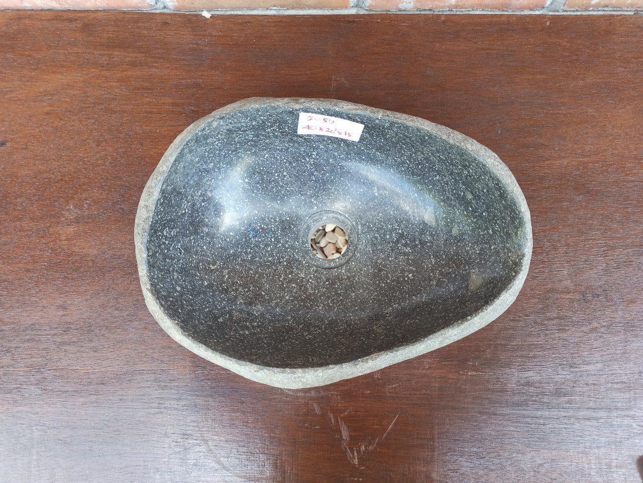 Top view of 5059-4028 handcrafted river stone sink — polished interior and natural rough exterior
