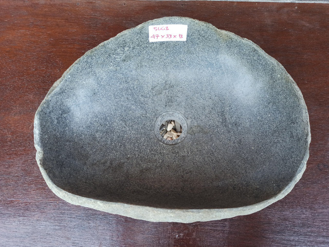 Top view of 5063-473313 handcrafted oval river stone sink — polished interior, natural exterior texture
