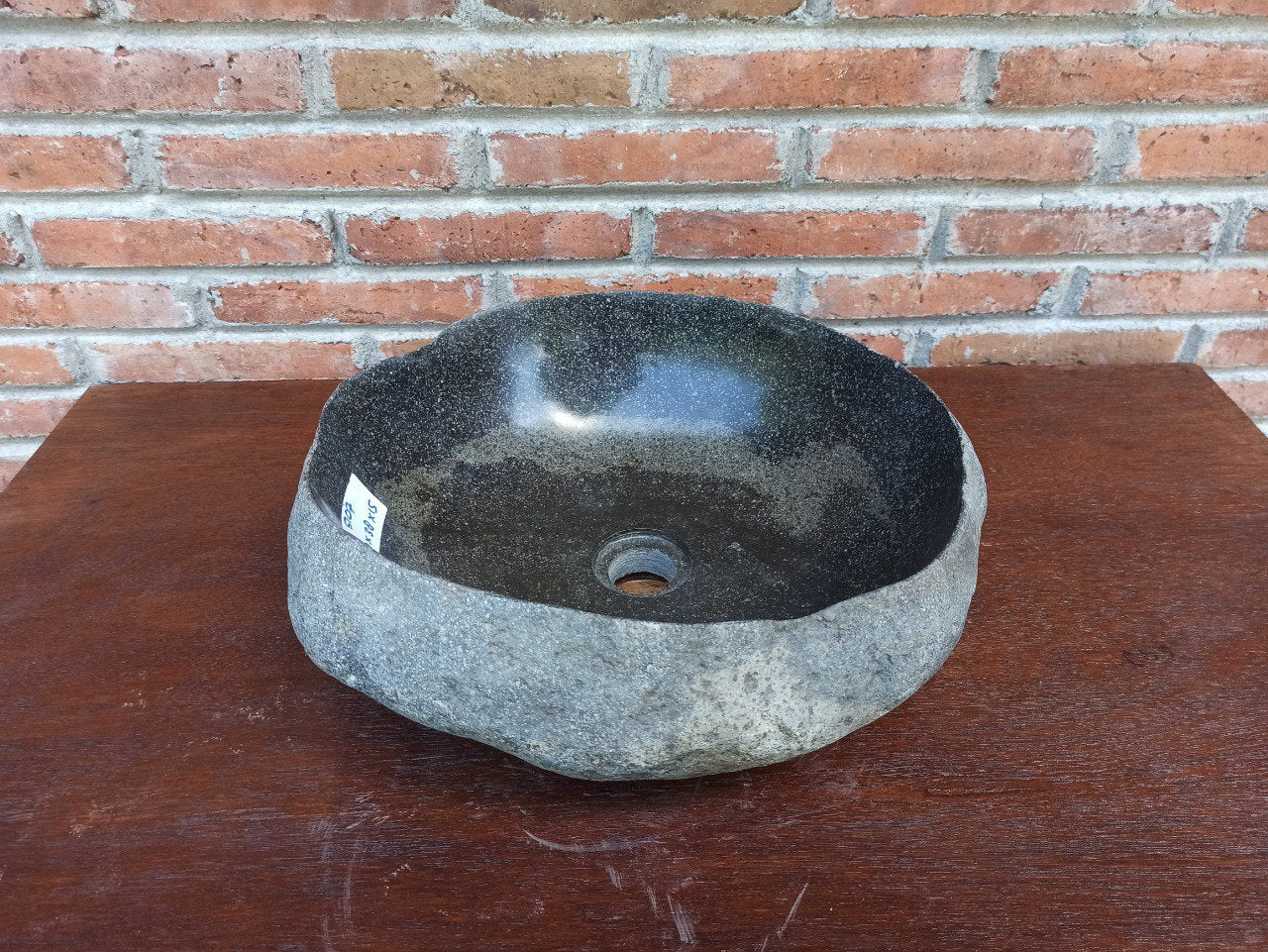 Top view of 5107-4038 round handcrafted river stone sink — polished basin, raw stone texture
