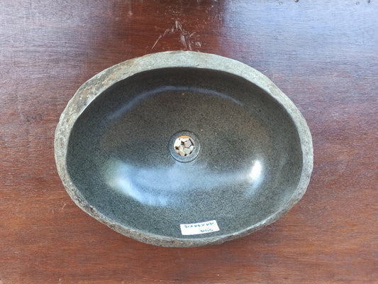 Top view of 5114-4434 oval river stone sink — polished dark basin, natural stone texture

