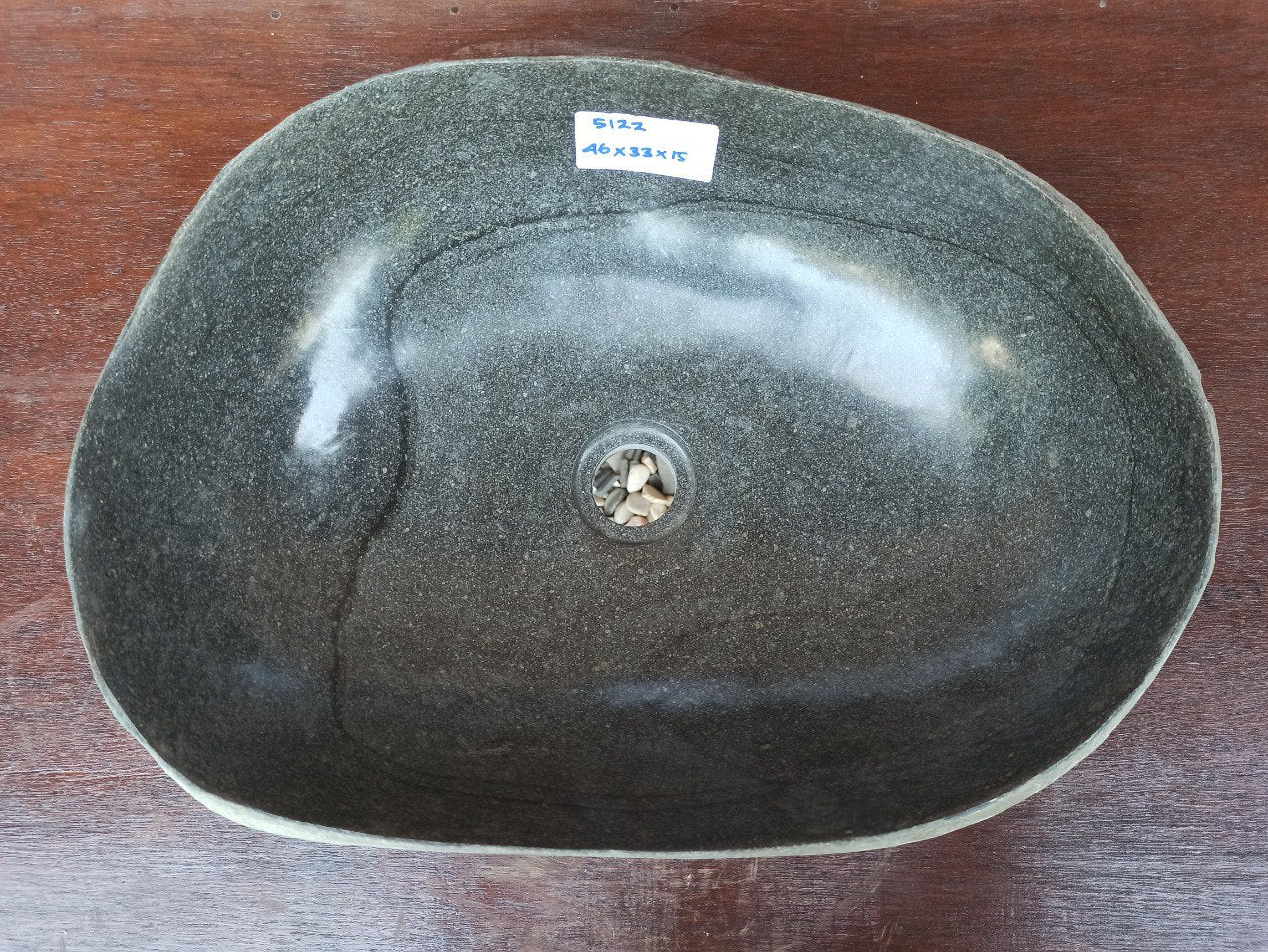 Top view of 5122-4333 oval river stone sink — handcrafted with polished dark interior
