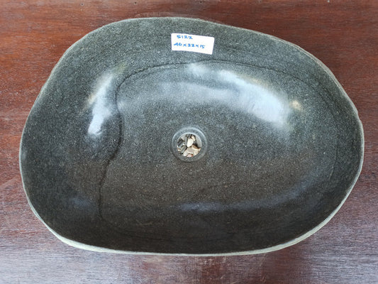 Top view of 5122-4333 oval river stone sink — handcrafted with polished dark interior
