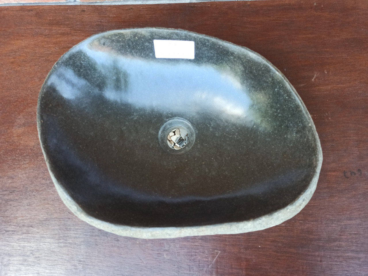Top view of 5143-453314 handcrafted river stone sink — polished interior and natural exterior
