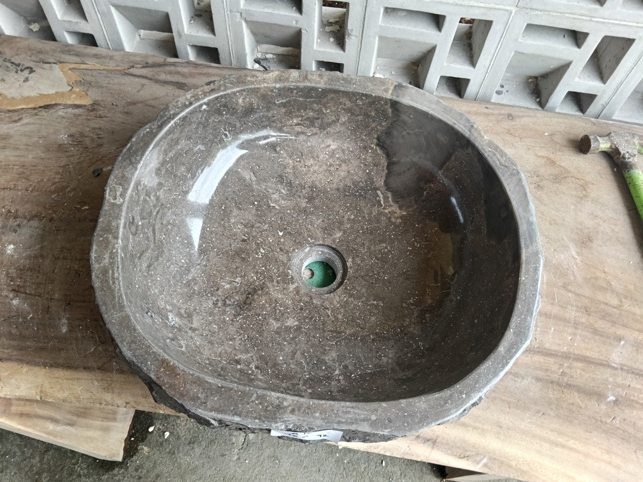 Top view of A10-4842 brown–taupe marble sink with polished interior and rough natural exterior, organic oval-rectangular shape.
