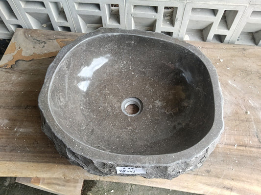 Top view of A24-4843 brown–taupe marble sink with polished interior and rough natural exterior, organic oval-rectangular shape.
