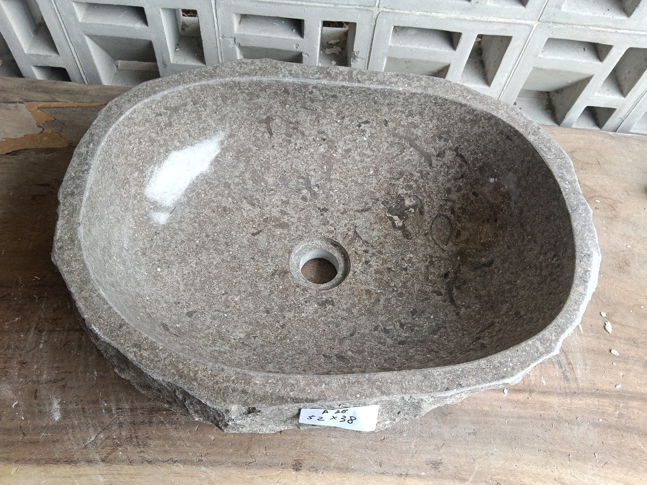 Top view of A28-5238 brown–taupe marble sink with polished interior and rough natural exterior, organic oval-rectangular shape.
