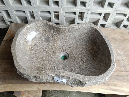 Top view of A29-5940 brown–taupe marble sink with polished interior and rough natural exterior, elongated organic S-shaped design.
